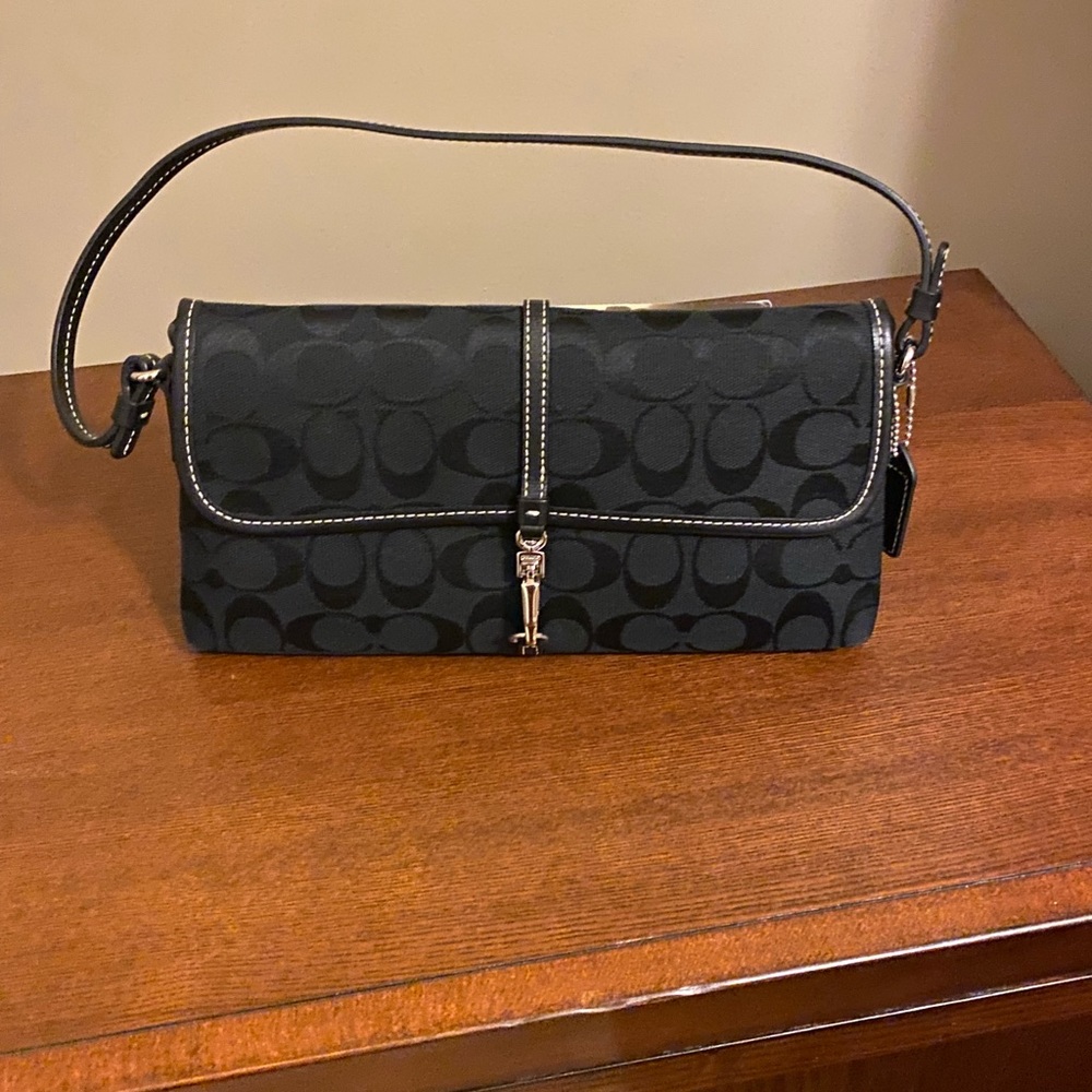 Coach black purse. Excellent condition, no stains. Looks brand new.